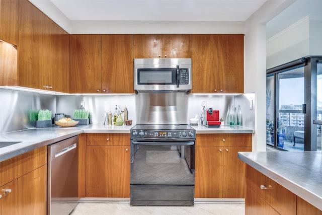 3030 Mckinney Ave Unit 1804, Dallas, TX 75204 - kitchen featuring stainless steel appliances, brown cabinets, and light countertops