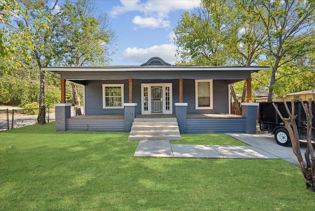 bungalow-style home featuring a porch, a front yard, and fence