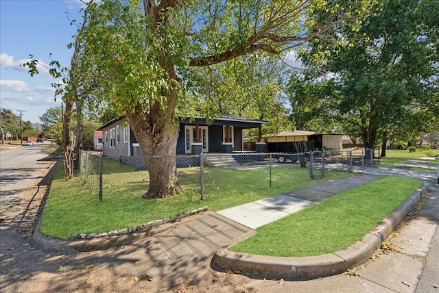 view of front of home featuring covered porch, a front lawn, and a fenced front yard
