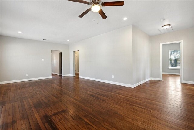 empty room with recessed lighting, a ceiling fan, baseboards, and dark wood-type flooring