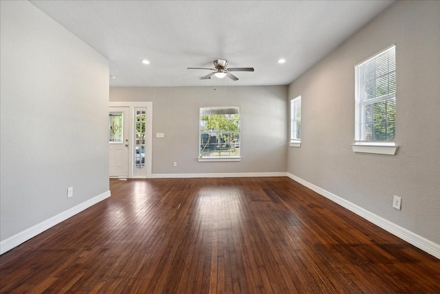 empty room featuring ceiling fan, recessed lighting, dark wood-style floors, and baseboards