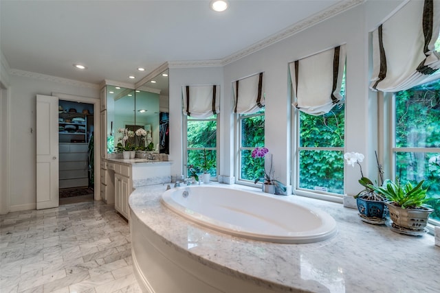 bathroom featuring a garden tub, crown molding, marble finish floor, vanity, and recessed lighting