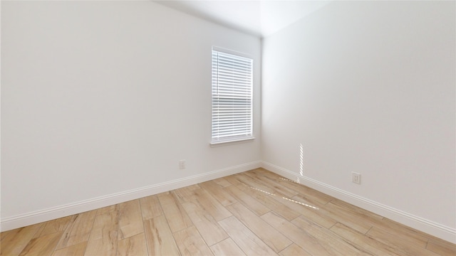 338 S 3rd St, Jacksboro, TX 76458 - empty room featuring a healthy amount of sunlight, light wood-style flooring, and baseboards
