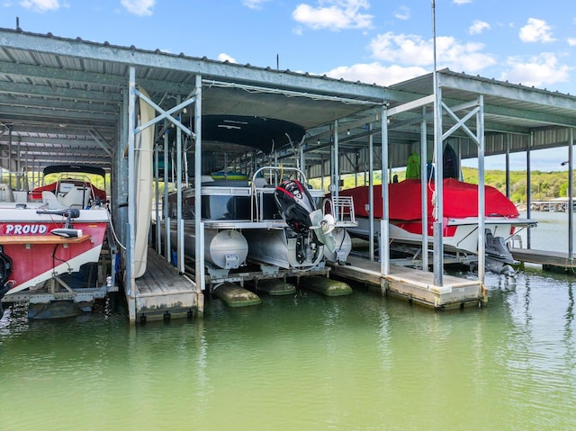 dock area featuring a water view and boat lift