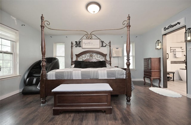 bedroom featuring dark wood finished floors and baseboards
