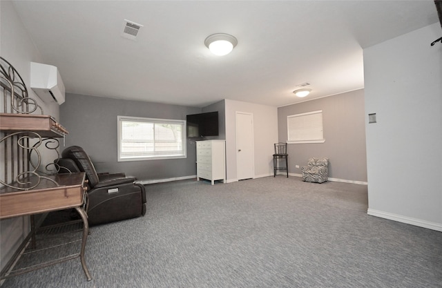 sitting room featuring baseboards, visible vents, and carpet