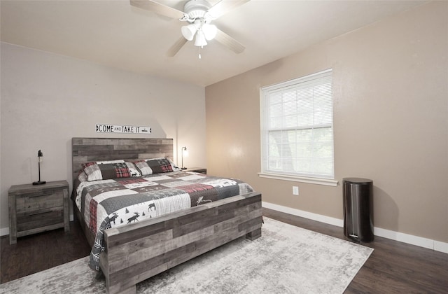 bedroom with wood finished floors, ceiling fan, and baseboards