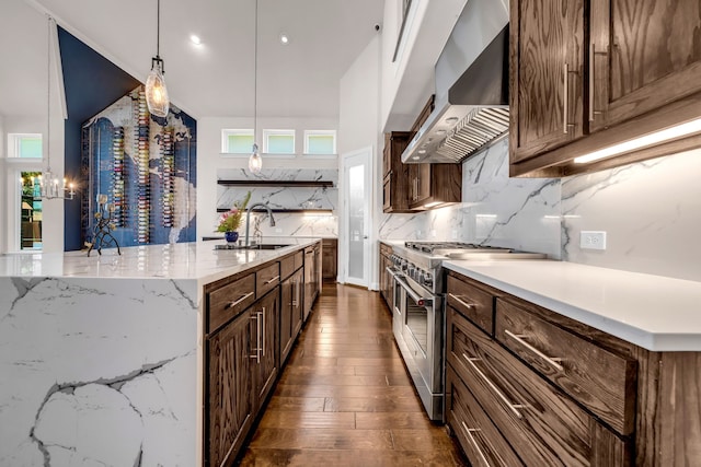509 Basilica Ln, Mckinney, TX 75071 - kitchen with double oven range, wall chimney exhaust hood, a sink, dark wood-style flooring, and backsplash