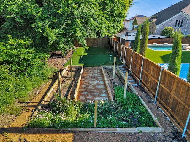 509 Basilica Ln, Mckinney, TX 75071 - fenced backyard featuring a garden