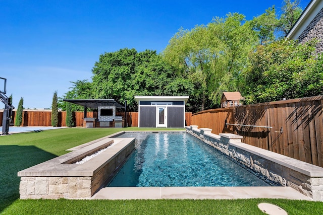 509 Basilica Ln, Mckinney, TX 75071 - view of pool featuring an outbuilding, exterior kitchen, a shed, and a patio area