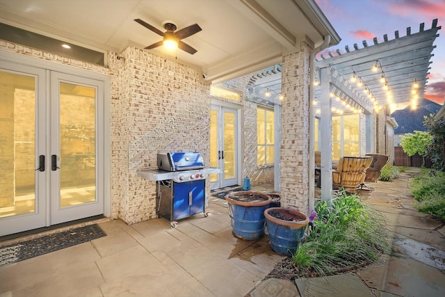 view of patio with french doors, fence, ceiling fan, and a grill