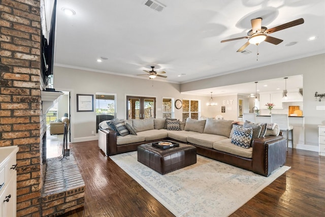 living area featuring visible vents, a ceiling fan, dark wood finished floors, and recessed lighting