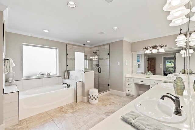 bathroom featuring crown molding, a bath, a stall shower, and a sink