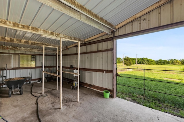 interior space featuring a rural view, an exterior structure, and an outbuilding