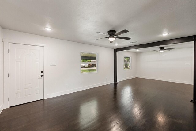 unfurnished living room with visible vents, baseboards, ceiling fan, recessed lighting, and dark wood finished floors