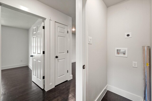 corridor featuring baseboards and dark wood-style flooring