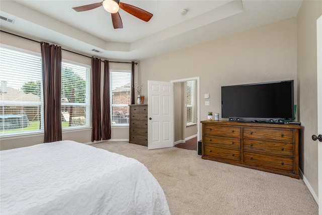 bedroom featuring baseboards, visible vents, a ceiling fan, and carpet