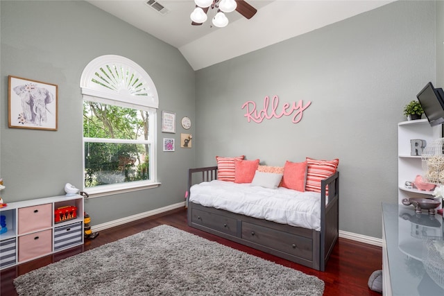 bedroom with lofted ceiling, dark wood-type flooring, visible vents, and multiple windows