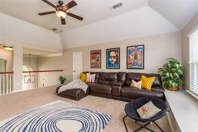 living room with carpet, visible vents, a ceiling fan, and vaulted ceiling