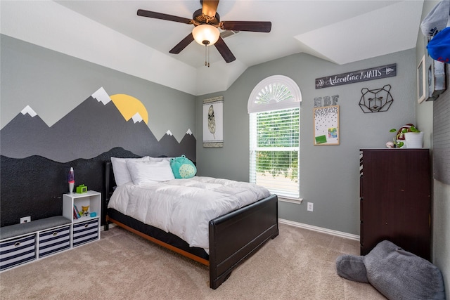 bedroom with a ceiling fan, vaulted ceiling, carpet floors, and baseboards