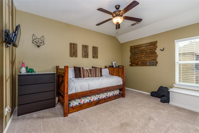 bedroom with a ceiling fan, multiple windows, carpet floors, and baseboards