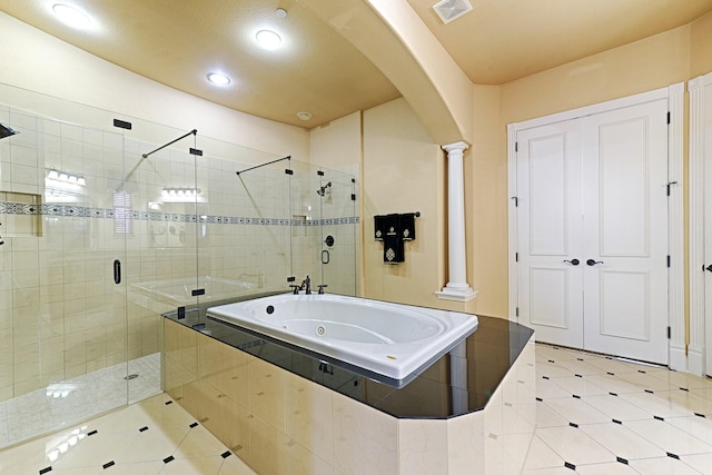 bathroom featuring recessed lighting, decorative columns, a stall shower, visible vents, and a jetted tub