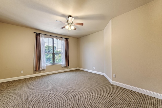 unfurnished room featuring baseboards, ceiling fan, and carpet flooring