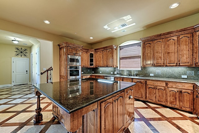 kitchen with visible vents, brown cabinets, appliances with stainless steel finishes, and recessed lighting