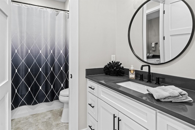 bathroom with toilet and vanity
