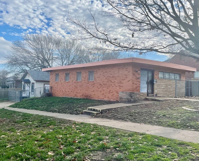 1317 Harrington Ave, Fort Worth, TX 76164 - view of property exterior with fence and brick siding