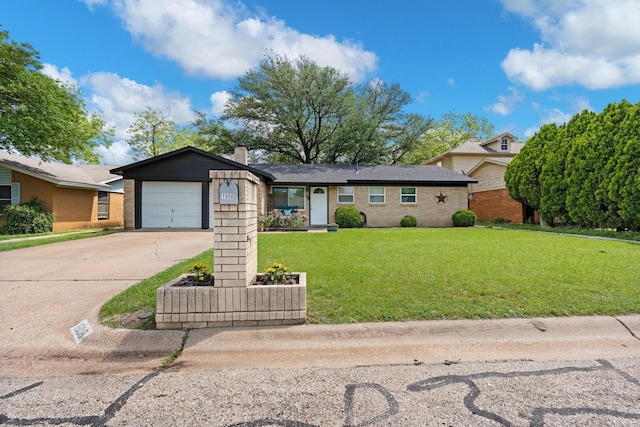 ranch-style house featuring a chimney, brick siding, a garage, a front yard, and concrete driveway
