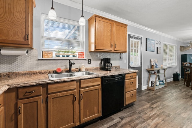 kitchen featuring black dishwasher, crown molding, a sink, and decorative backsplash