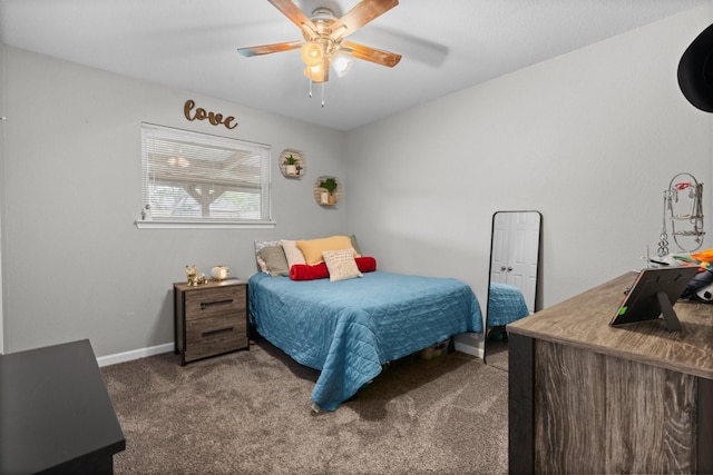 carpeted bedroom featuring a ceiling fan and baseboards