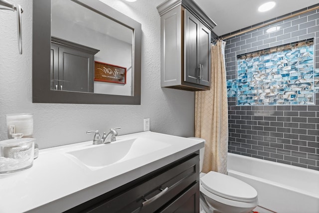 bathroom with shower / bathtub combination with curtain, a textured wall, toilet, and vanity