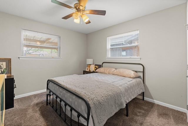 bedroom featuring dark colored carpet, ceiling fan, and baseboards