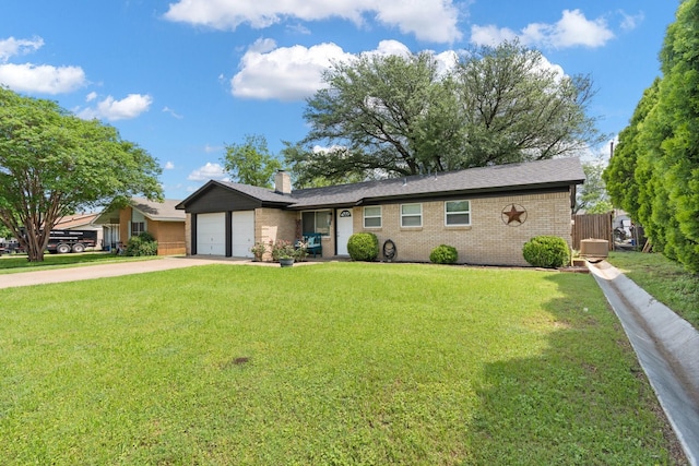 ranch-style home featuring a front yard, a chimney, brick siding, concrete driveway, and an attached garage