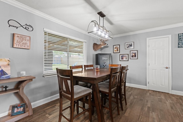 dining room with dark wood-style floors, baseboards, and ornamental molding