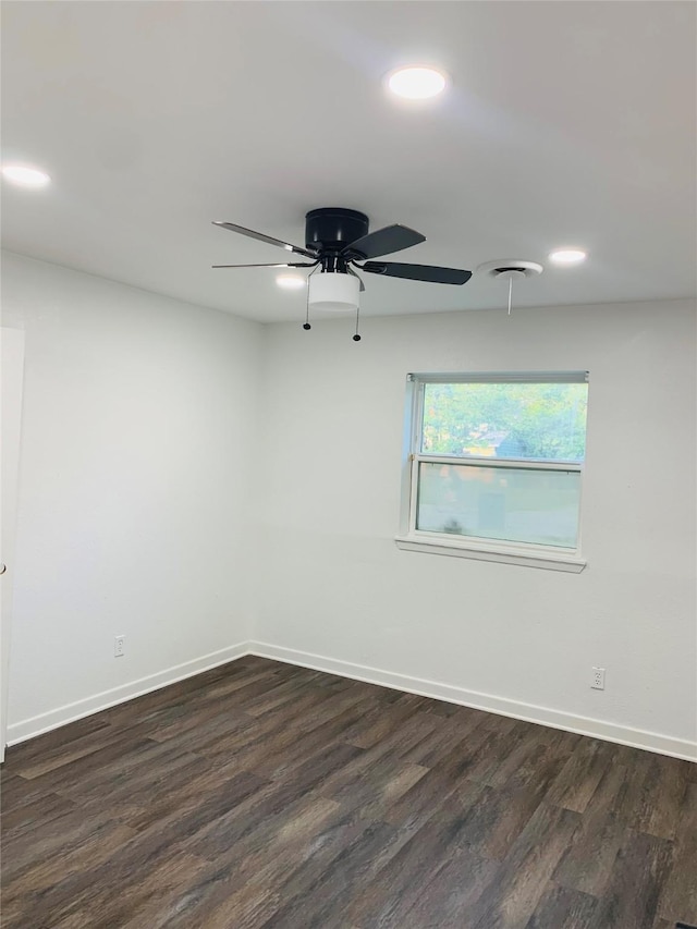 empty room with recessed lighting, dark wood-style flooring, ceiling fan, and baseboards