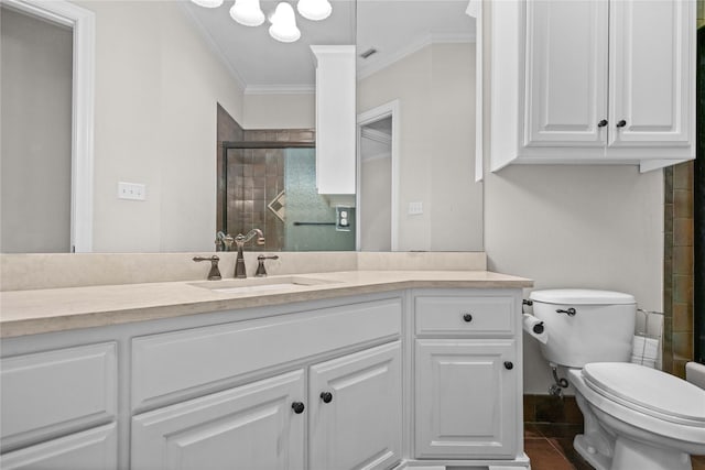bathroom featuring ornamental molding, tiled shower, toilet, and vanity
