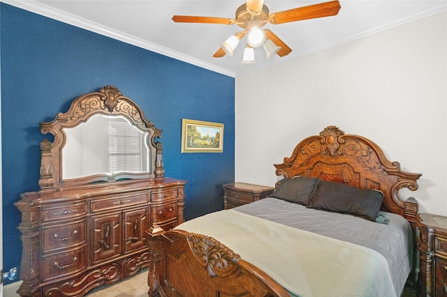 carpeted bedroom with a ceiling fan and ornamental molding