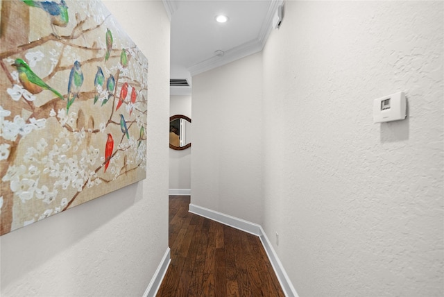 corridor with recessed lighting, visible vents, baseboards, ornamental molding, and wood finished floors