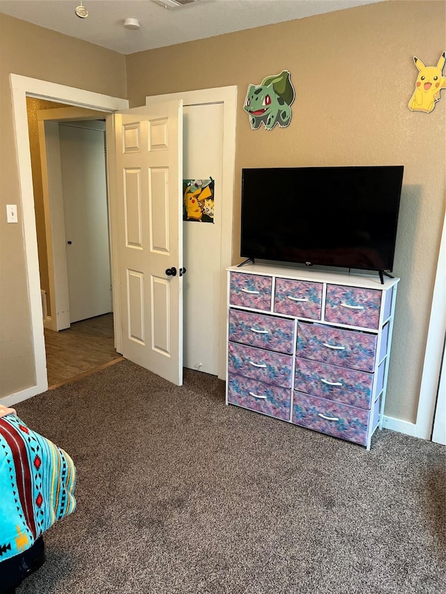 carpeted bedroom with visible vents