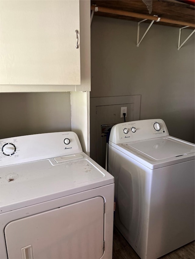 washroom with dark wood-style floors and washer and clothes dryer