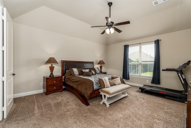 carpeted bedroom with baseboards, a ceiling fan, vaulted ceiling, and visible vents