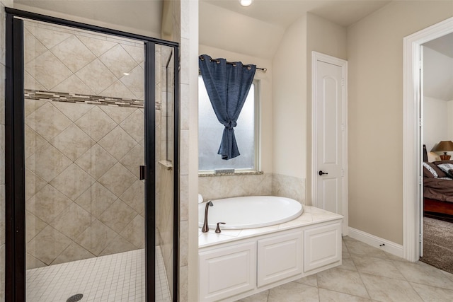 full bath with a garden tub, baseboards, ensuite bath, and a stall shower