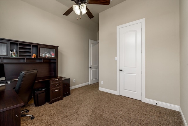 office area with a ceiling fan, baseboards, light colored carpet, and vaulted ceiling