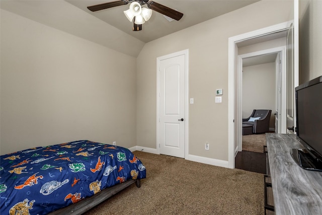 carpeted bedroom with vaulted ceiling, baseboards, and a ceiling fan