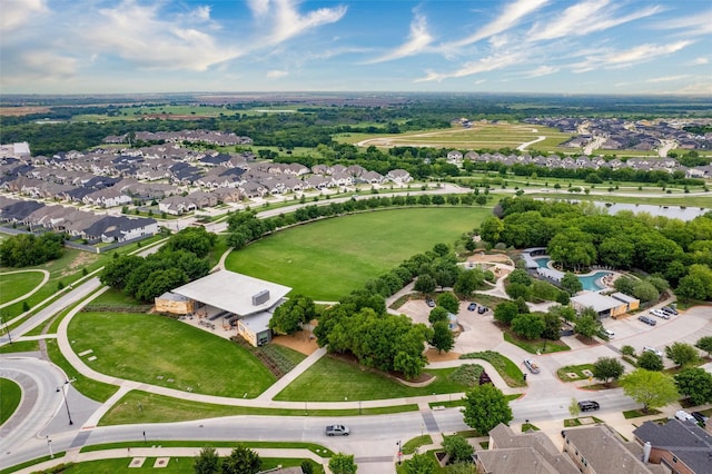 birds eye view of property featuring a water view and a residential view