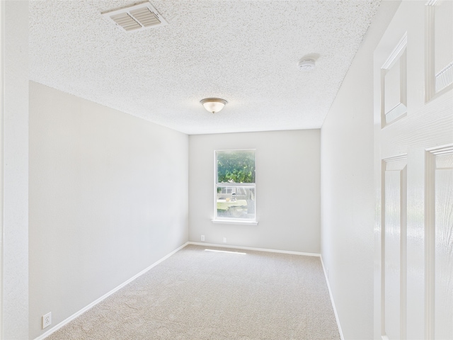 1117 Victoria Dr, Saginaw, TX 76131 - carpeted spare room with a textured ceiling, visible vents, and baseboards
