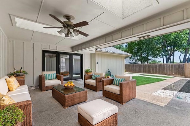 764 Cardinal Ln, Coppell, TX 75019 - fenced backyard with a patio area, outdoor lounge area, and ceiling fan
